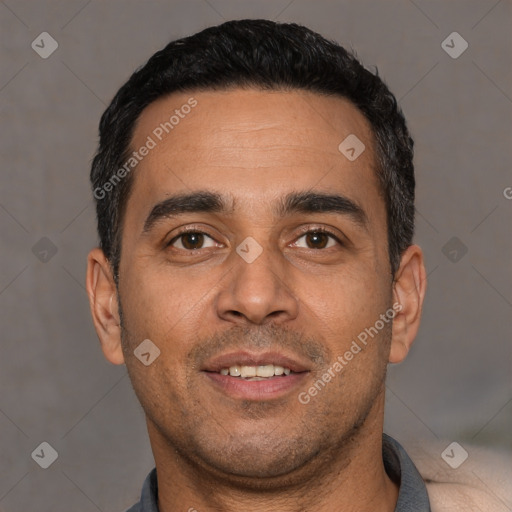 Joyful white young-adult male with short  black hair and brown eyes