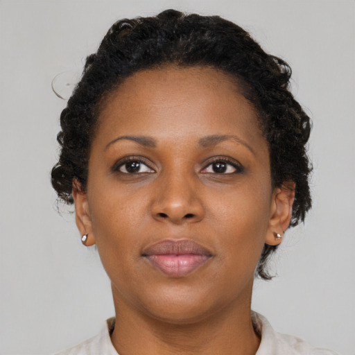 Neutral black young-adult female with short  brown hair and brown eyes