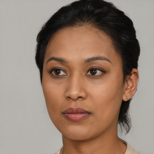 Joyful asian young-adult female with short  brown hair and brown eyes