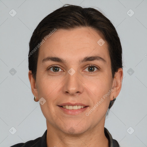 Joyful white adult female with short  brown hair and brown eyes