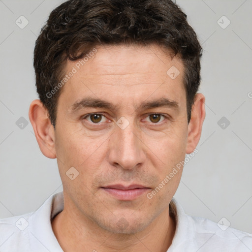 Joyful white adult male with short  brown hair and brown eyes