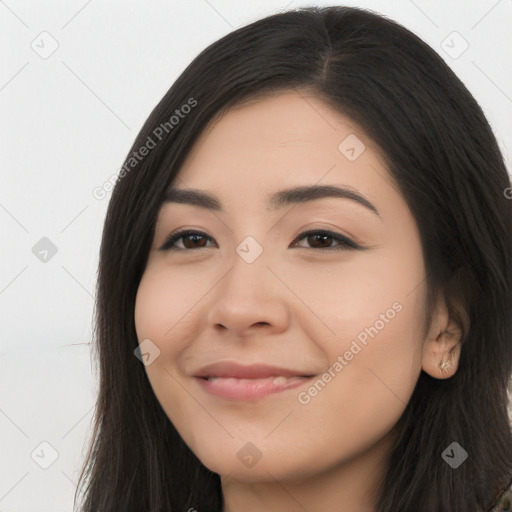 Joyful latino young-adult female with long  brown hair and brown eyes