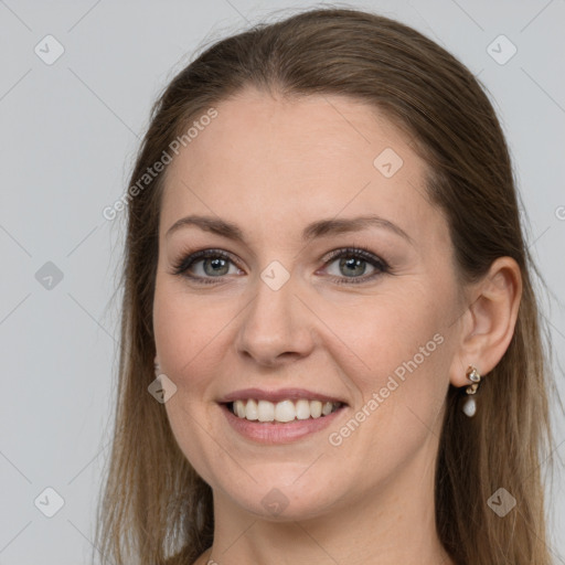 Joyful white young-adult female with long  brown hair and grey eyes