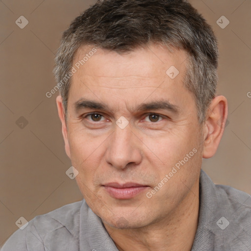 Joyful white adult male with short  brown hair and brown eyes