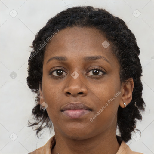 Neutral black young-adult female with medium  brown hair and brown eyes