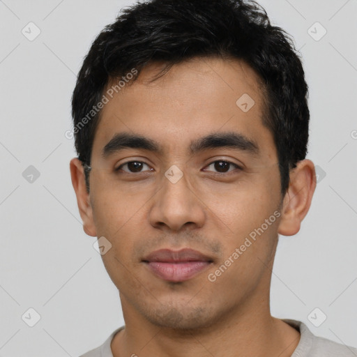 Neutral latino young-adult male with short  black hair and brown eyes