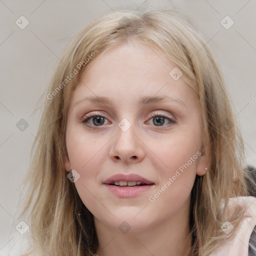 Joyful white young-adult female with medium  brown hair and blue eyes