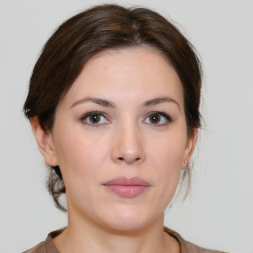 Neutral white young-adult female with medium  brown hair and brown eyes