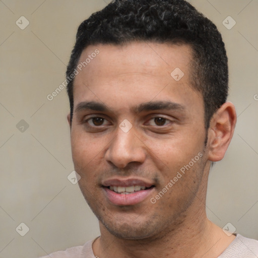 Joyful white young-adult male with short  black hair and brown eyes