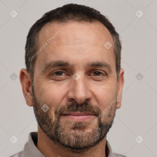 Joyful white adult male with short  brown hair and brown eyes