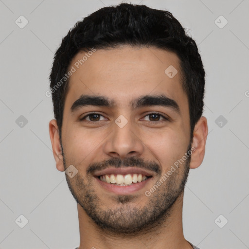 Joyful latino young-adult male with short  black hair and brown eyes