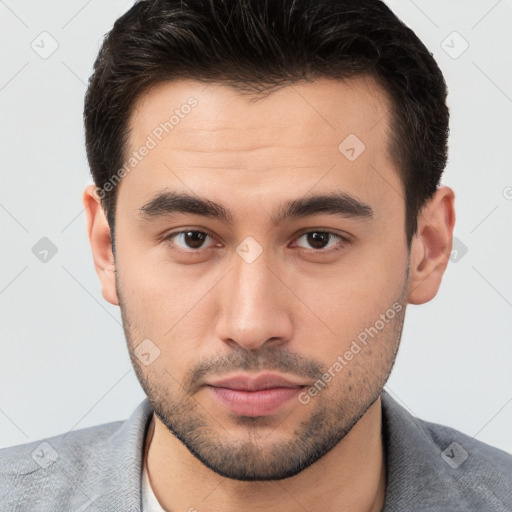 Neutral white young-adult male with short  brown hair and brown eyes