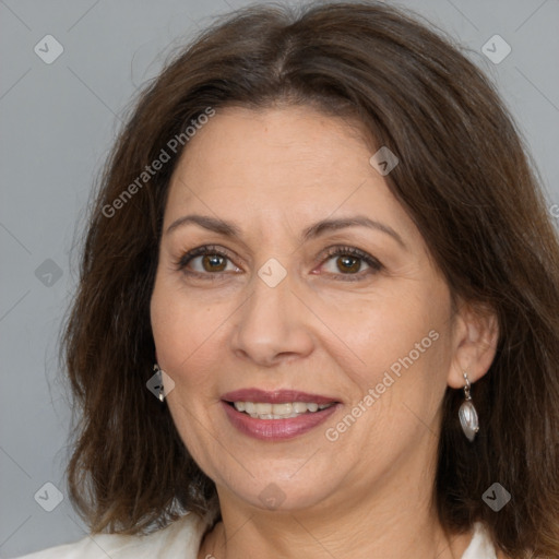 Joyful white adult female with medium  brown hair and brown eyes