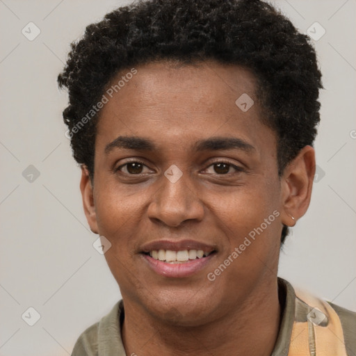 Joyful black young-adult male with short  brown hair and brown eyes