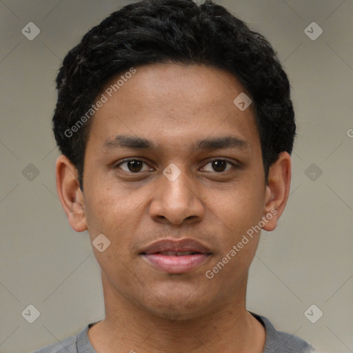 Joyful black young-adult male with short  brown hair and brown eyes