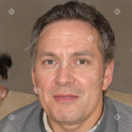 Joyful white middle-aged male with short  brown hair and brown eyes