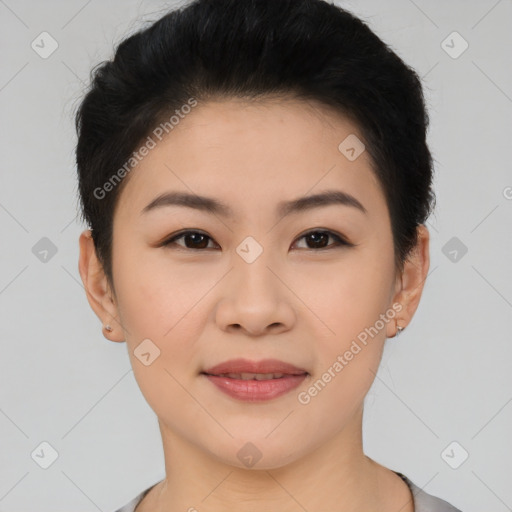 Joyful asian young-adult female with short  black hair and brown eyes