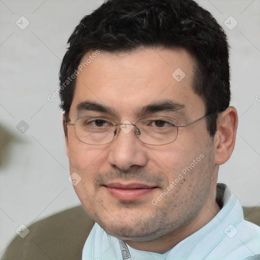 Joyful white adult male with short  black hair and brown eyes