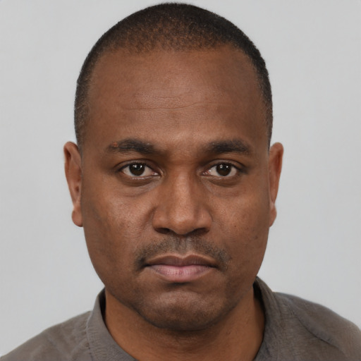 Neutral black young-adult male with short  brown hair and brown eyes