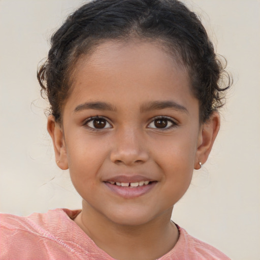 Joyful white child female with short  brown hair and brown eyes