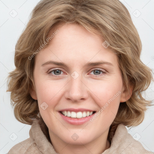 Joyful white young-adult female with medium  brown hair and blue eyes