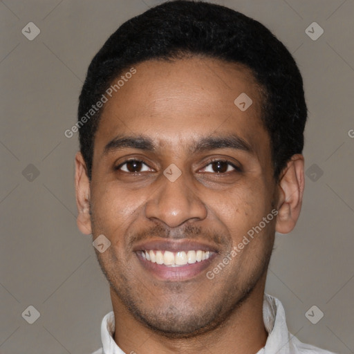 Joyful latino young-adult male with short  black hair and brown eyes