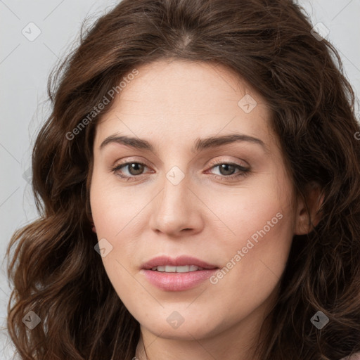 Joyful white young-adult female with long  brown hair and green eyes