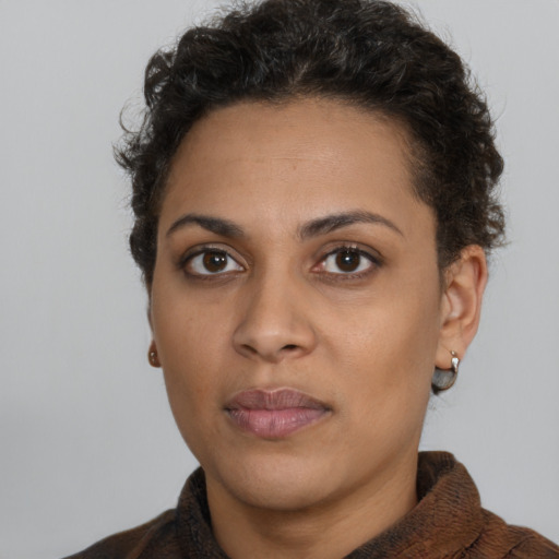 Neutral latino young-adult female with short  brown hair and brown eyes