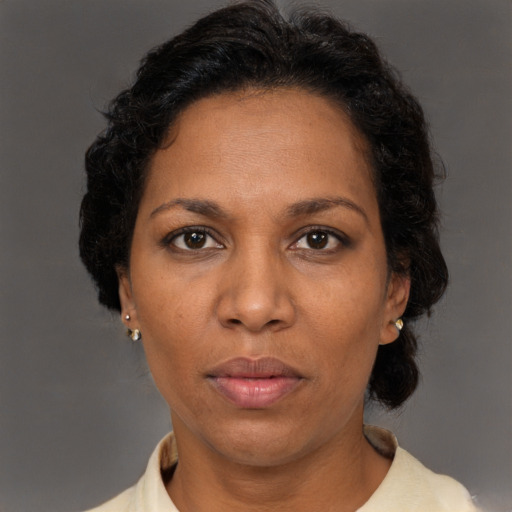 Neutral black adult female with short  brown hair and brown eyes