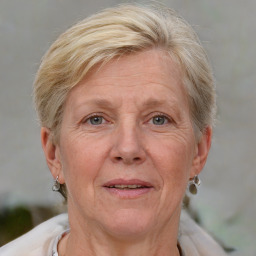 Joyful white middle-aged female with medium  blond hair and grey eyes