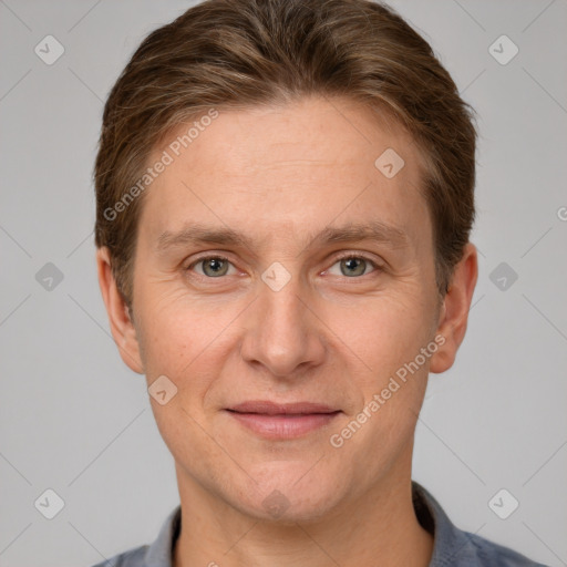 Joyful white adult male with short  brown hair and grey eyes