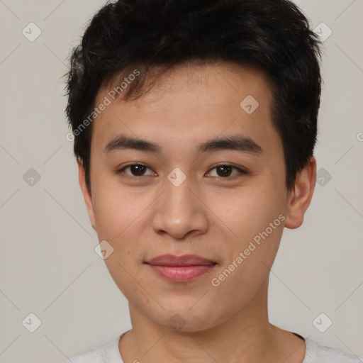 Joyful asian young-adult male with short  black hair and brown eyes