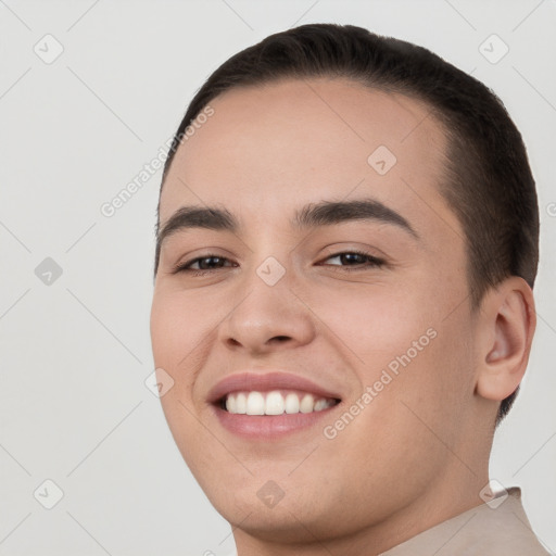 Joyful white young-adult male with short  brown hair and brown eyes