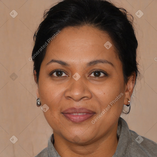 Joyful latino adult female with medium  brown hair and brown eyes