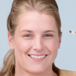 Joyful white young-adult female with long  brown hair and blue eyes