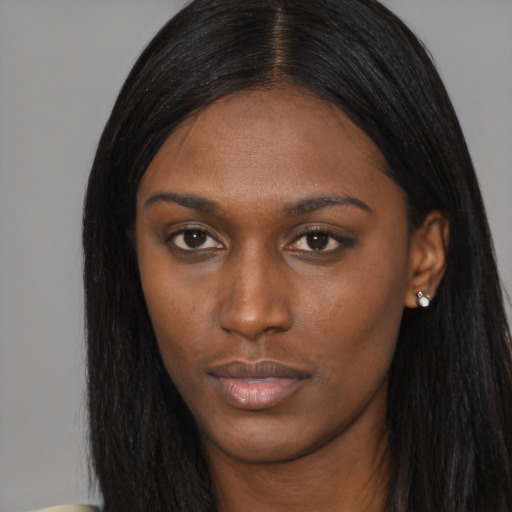 Neutral black young-adult female with long  black hair and brown eyes
