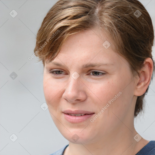 Joyful white young-adult female with medium  brown hair and blue eyes