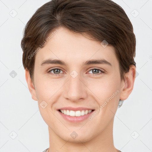 Joyful white young-adult female with short  brown hair and grey eyes