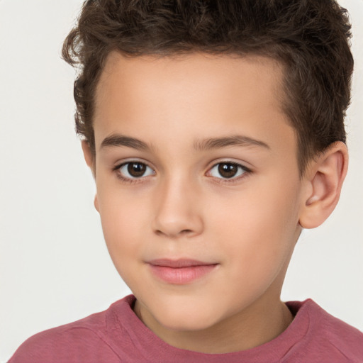 Joyful white child male with short  brown hair and brown eyes