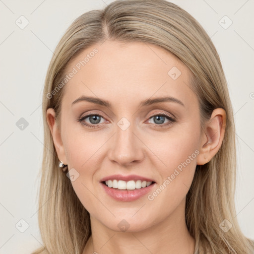 Joyful white young-adult female with long  brown hair and blue eyes