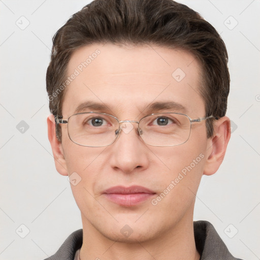 Joyful white adult male with short  brown hair and grey eyes