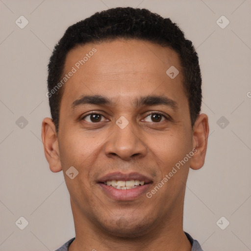 Joyful white young-adult male with short  black hair and brown eyes