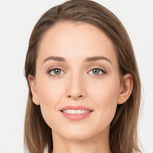 Joyful white young-adult female with long  brown hair and grey eyes