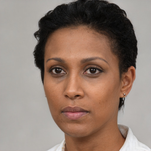 Neutral latino young-adult female with short  brown hair and brown eyes