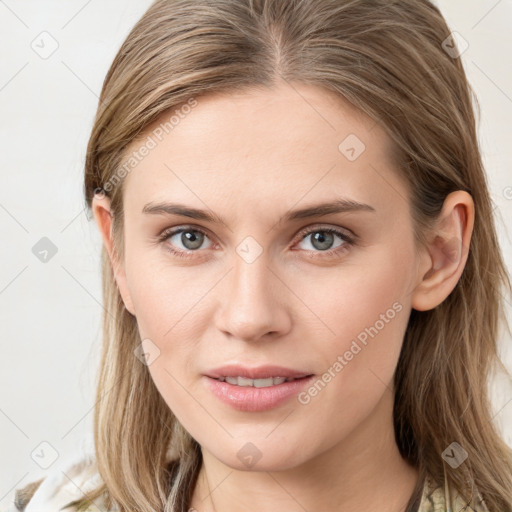 Joyful white young-adult female with long  brown hair and blue eyes