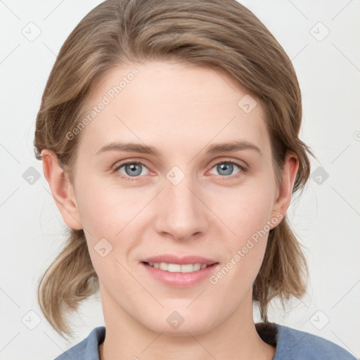 Joyful white young-adult female with medium  brown hair and blue eyes