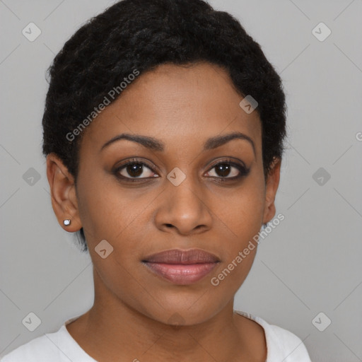 Joyful black young-adult female with short  black hair and brown eyes