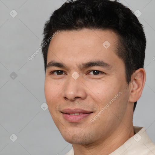 Joyful white young-adult male with short  black hair and brown eyes