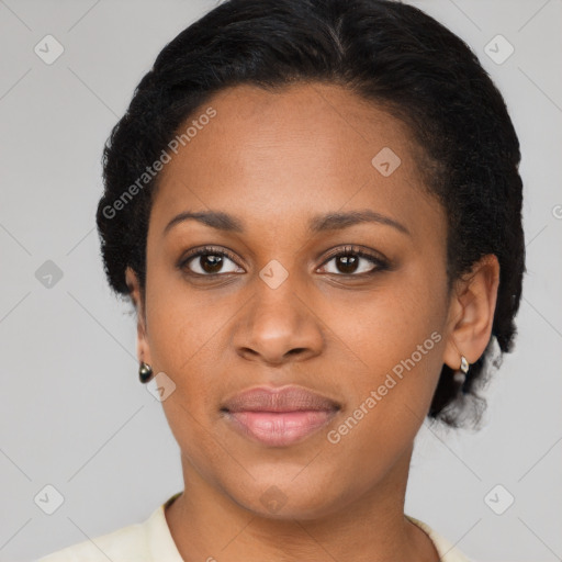 Joyful black young-adult female with short  brown hair and brown eyes