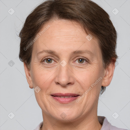 Joyful white adult female with short  brown hair and brown eyes